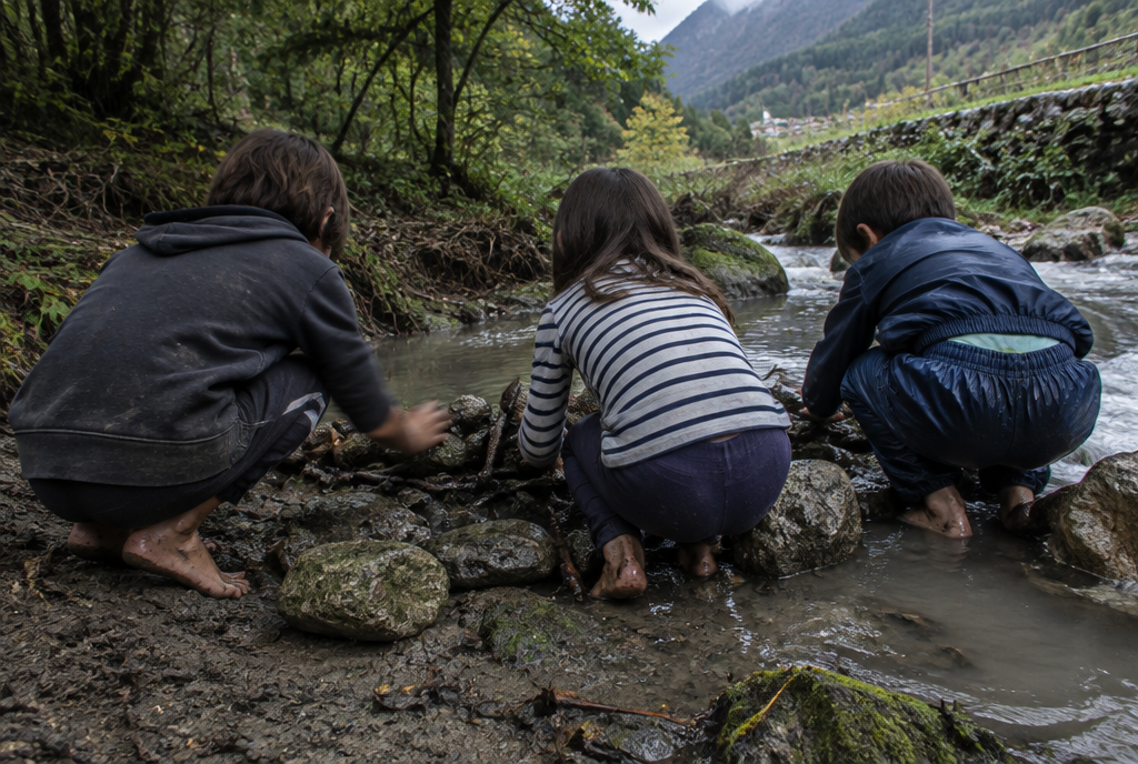 Bambini giocano tra le pietre di un torrente in Umbria